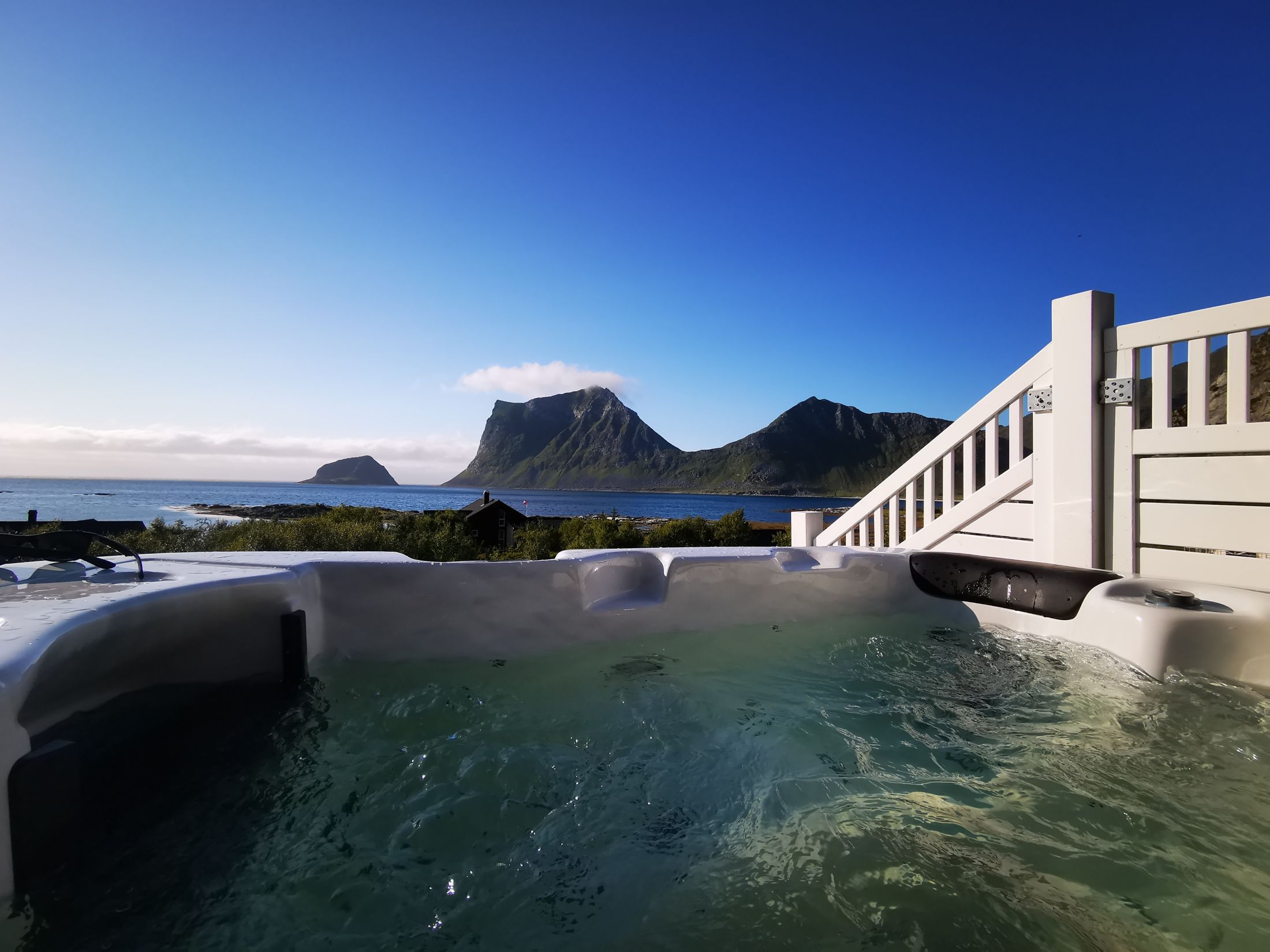 View from the jacuzzi on the terrace: the sea and the mountains on a clear summer day